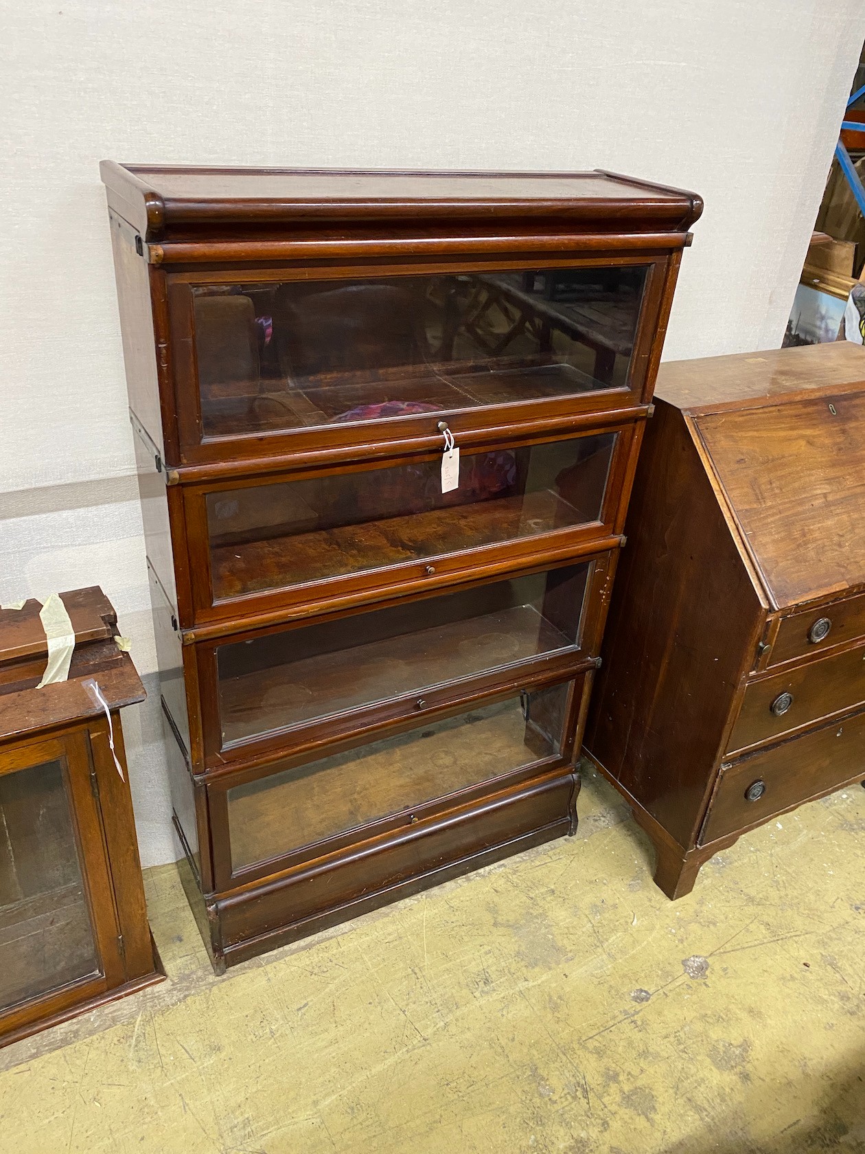 A Globe Wernicke mahogany four section bookcase, width 87cm, depth 27cm, height 141cm